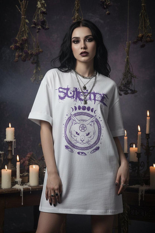 Person wearing a white t-shirt with purple graphic design and text.