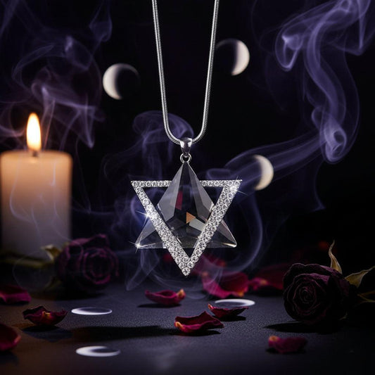 Triangular crystal pendant necklace on a dark background