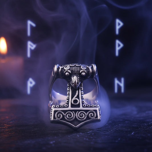 Silver Thor's hammer pendant on a dark background