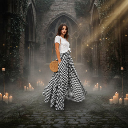 Person wearing a black and white checkered skirt with a woven bag on a neutral background