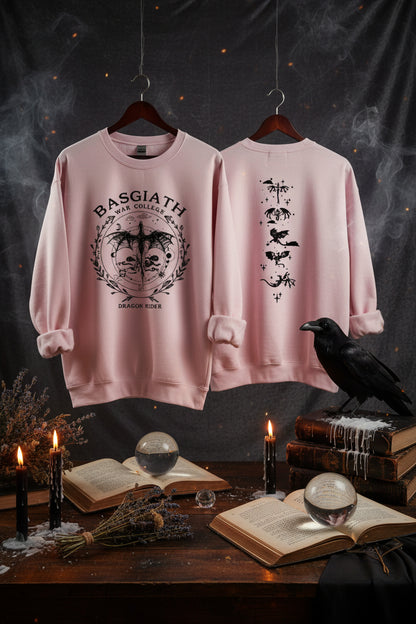 Two pink sweatshirts with printed designs on hangers against a gray background