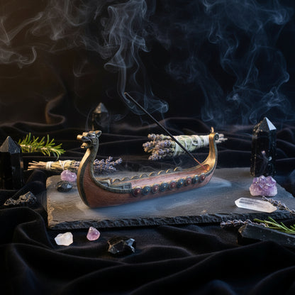 Viking ship incense burner with a single incense stick on a white background