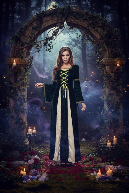 A woman modeling a medieval-style long dress costume with dark green velvet fabric, cream inner panels, and yellow lace-up detailing on the bodice, shown against a plain white background.