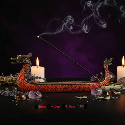 Dragon boat incense burner with incense stick on a white background
