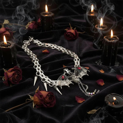 Dragon-shaped necklace with spikes on a dark surface