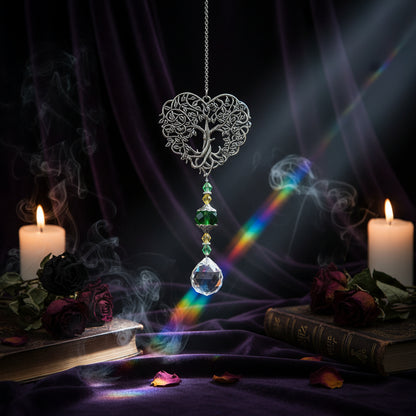 Decorative hanging heart-shaped ornament with crystals in a garden setting