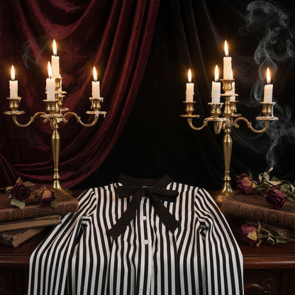 Black and white striped shirt with a bow tie on a white background