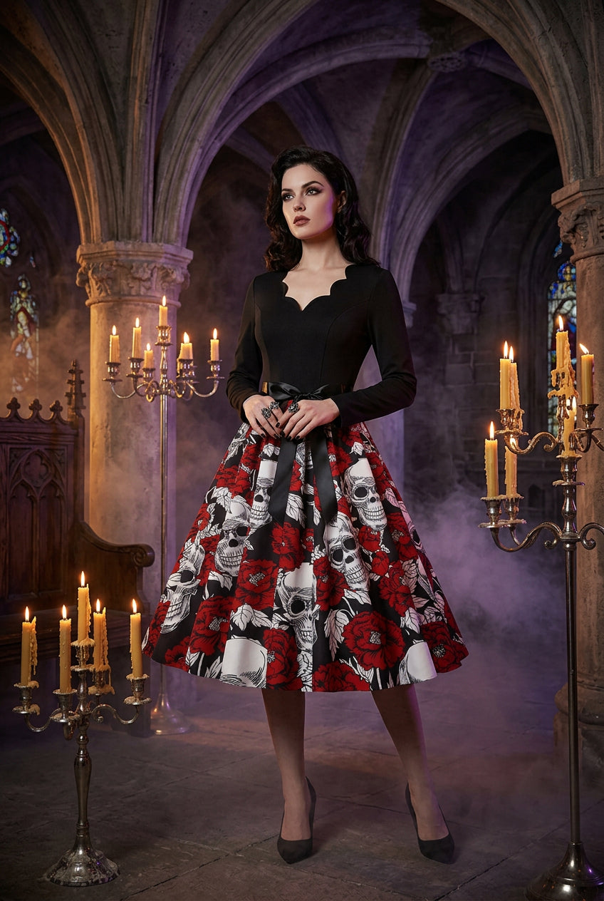 Black top with a red and white floral and skull patterned skirt on a white background
