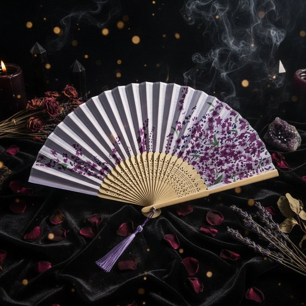 Two floral-patterned fans with a wooden handle on a light background with pink flowers.