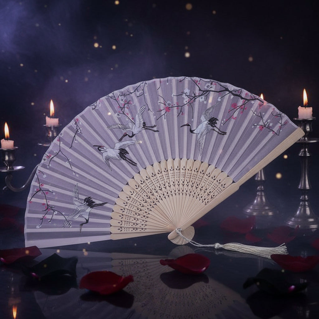 Handheld fan with cherry blossom and crane design on a white background