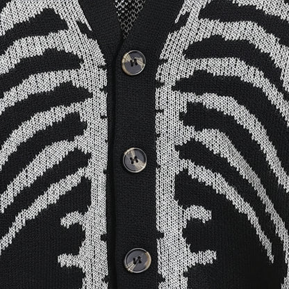 Close-up of a black and white patterned cardigan with button details.