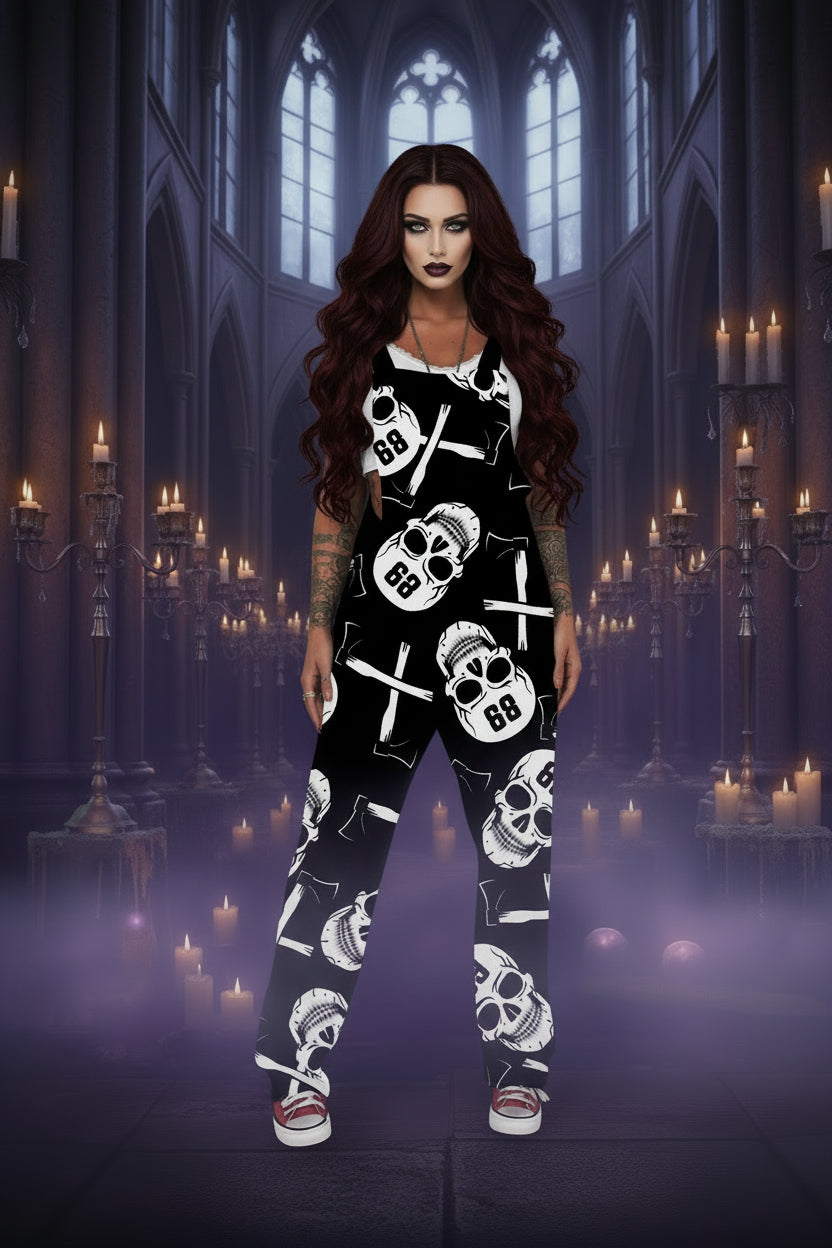 A woman modeling a black sleeveless jumpsuit with a white skull and crossbones pattern, standing indoors near a white wall and window.