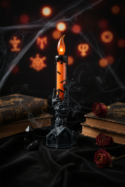 Decorative candle with a black hand holding a lit candle on a white background