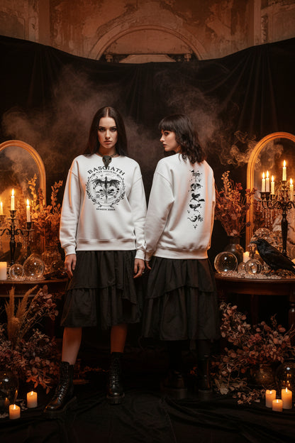 White sweatshirt with black graphics on a gray background