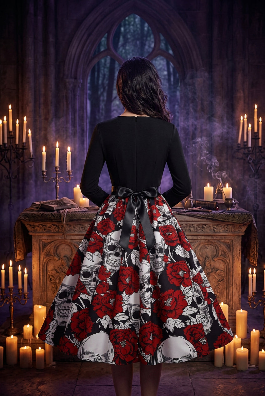 Black top with a red and white skull and rose patterned skirt on a white background