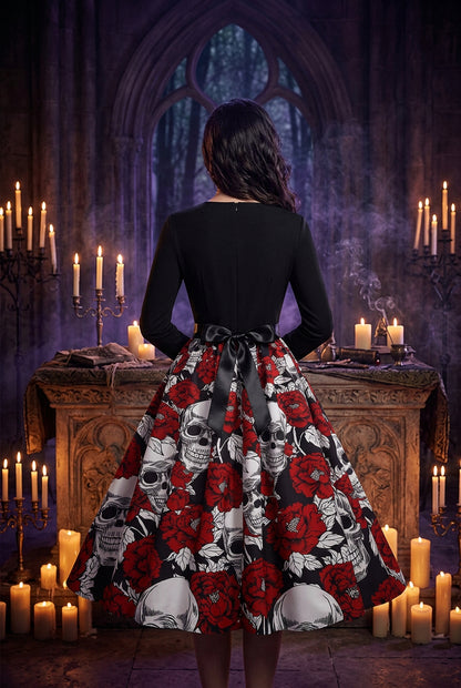 Black top with a red and white skull and rose patterned skirt on a white background