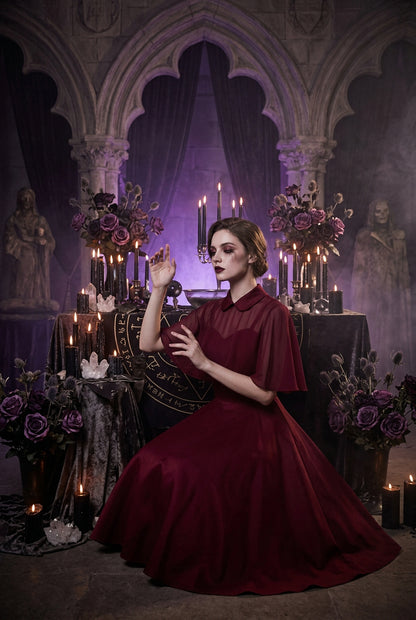 Red dress with cape on a white background