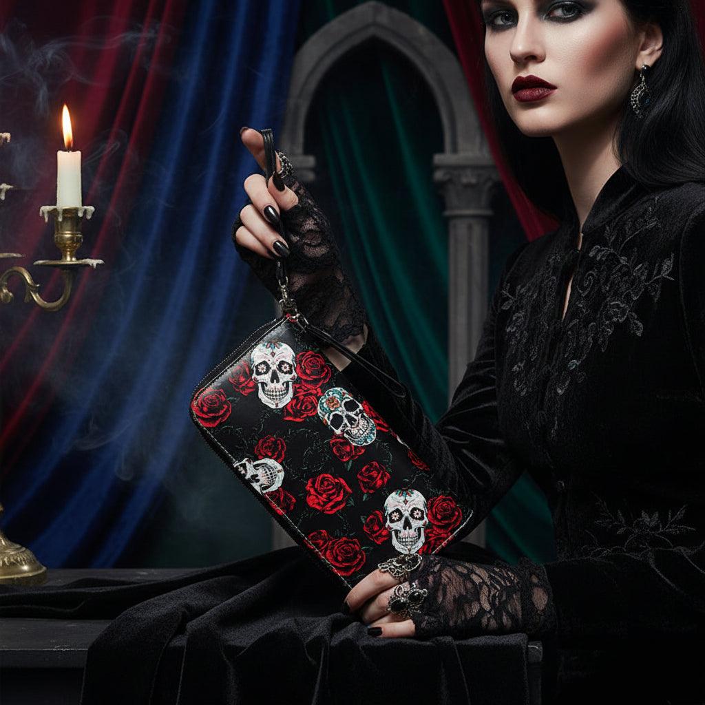 Black clutch bag with skull and rose pattern on a white background