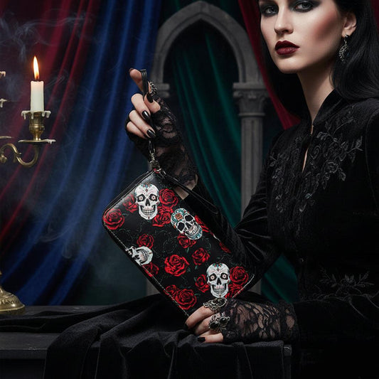 Black clutch bag with skull and rose pattern on a white background
