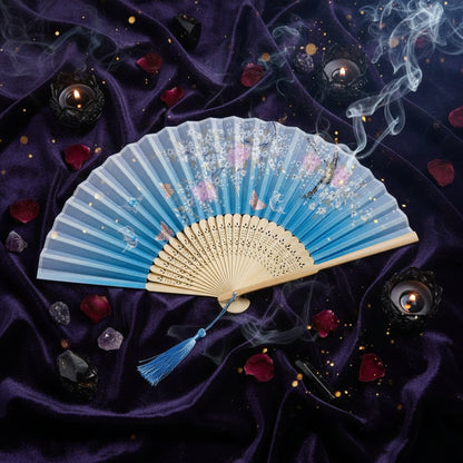 Light blue and beige fan with floral design on a white background with pink flowers.