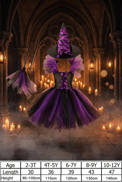 A children's witch costume set on a white background, including a black and purple tutu dress with a black corset-style bodice, a black pointed witch hat with purple ribbon, a black wand, and a small black-and-purple broom. A size chart at the bottom lists age, length, and height ranges for the costume.