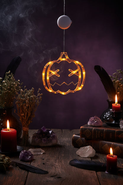 Decorative LED pumpkin light with glowing orange strings on a blurred background