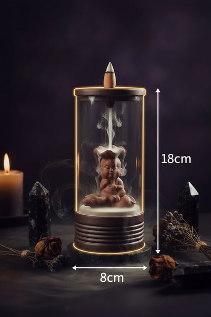 Decorative lamp with a small statue inside, showing dimensions on a white background