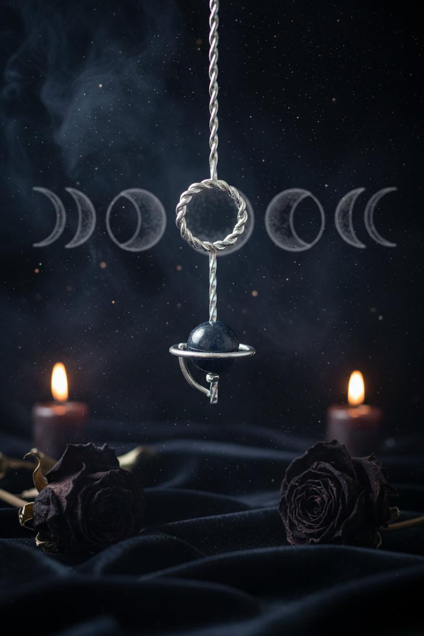 Keychain with a spherical object and chain on a light gray background