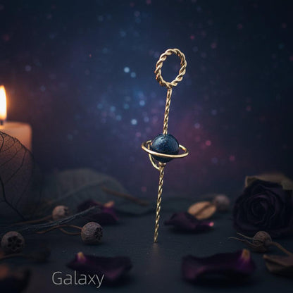 Gold keychain with a blue stone on a white background, labeled 'Galaxy'.