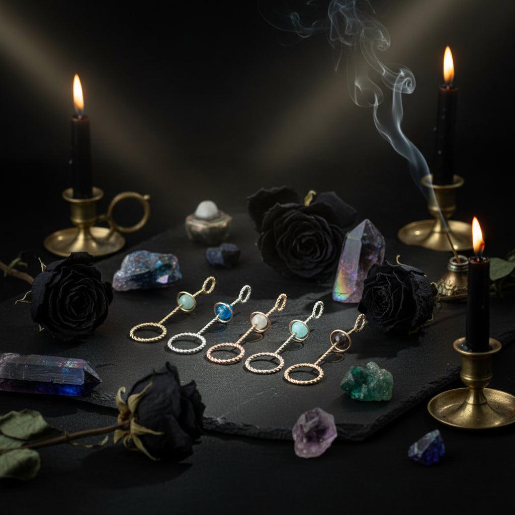 Set of earrings with gemstones on a light surface