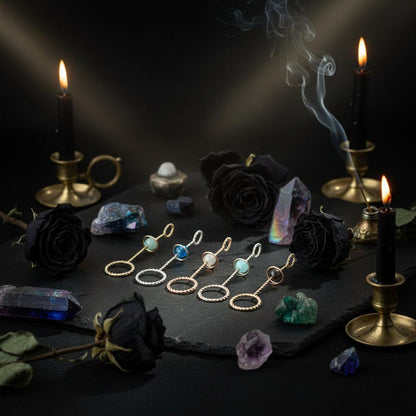 Set of earrings with gemstones on a light surface