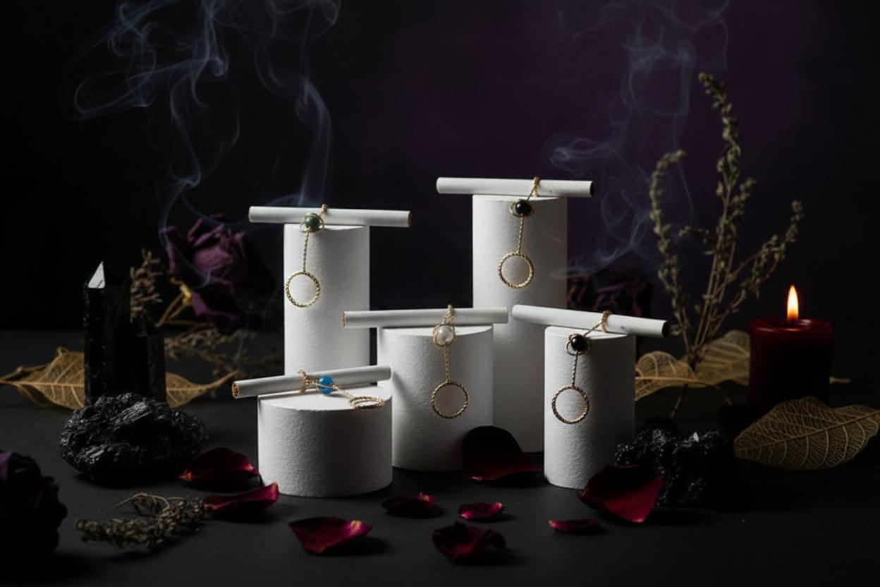 Gold rings with gemstones on a white stand