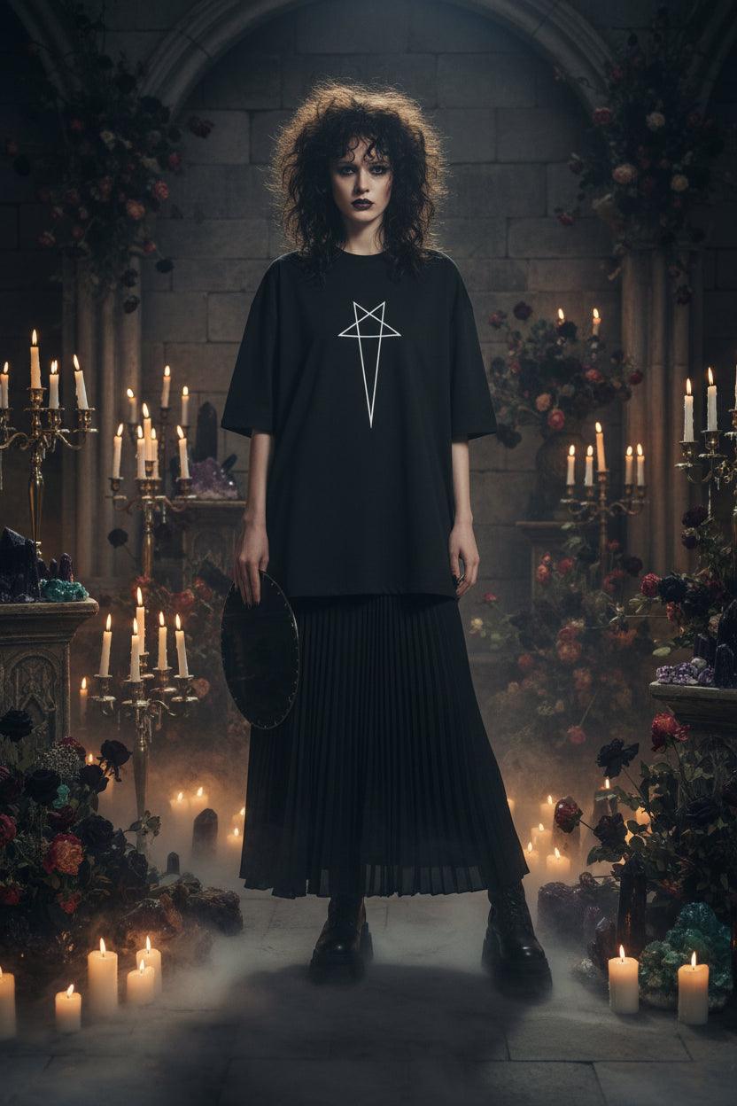 Black t-shirt with a white star design on a hanger against a white background