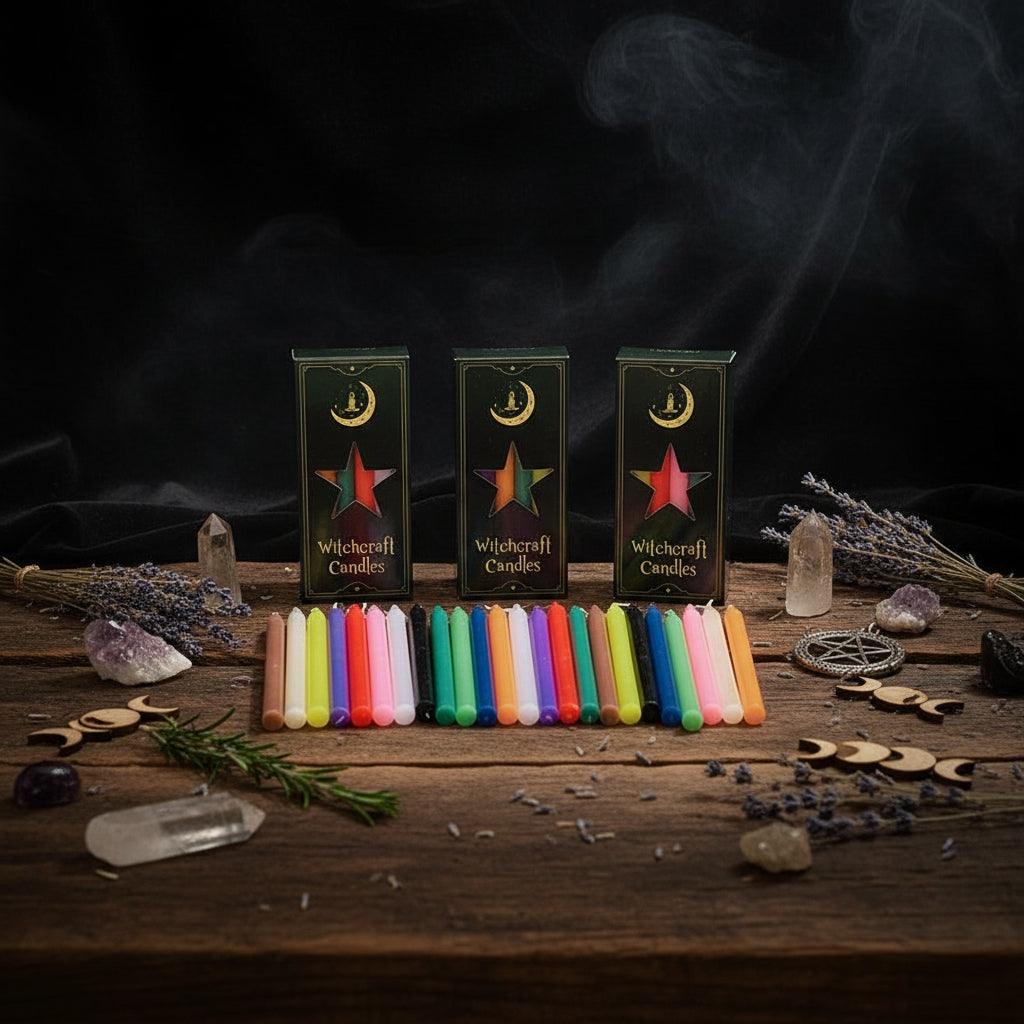Witchcraft candles in various colors with their packaging on a white background