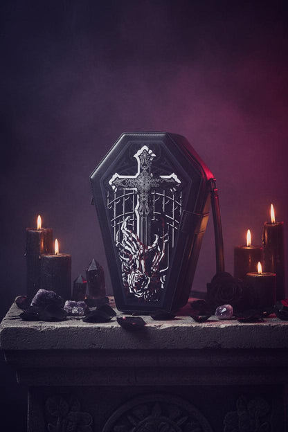 Black coffin-shaped bag with a sword and hand design on a white background