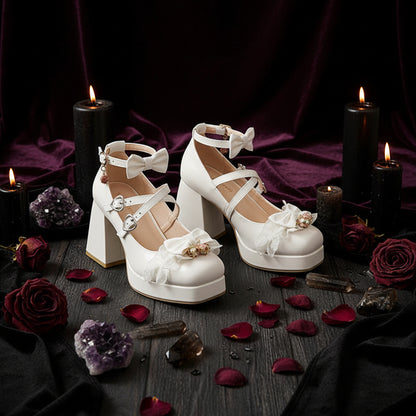 White lace-up platform shoes worn with sheer white socks on a wooden floor.