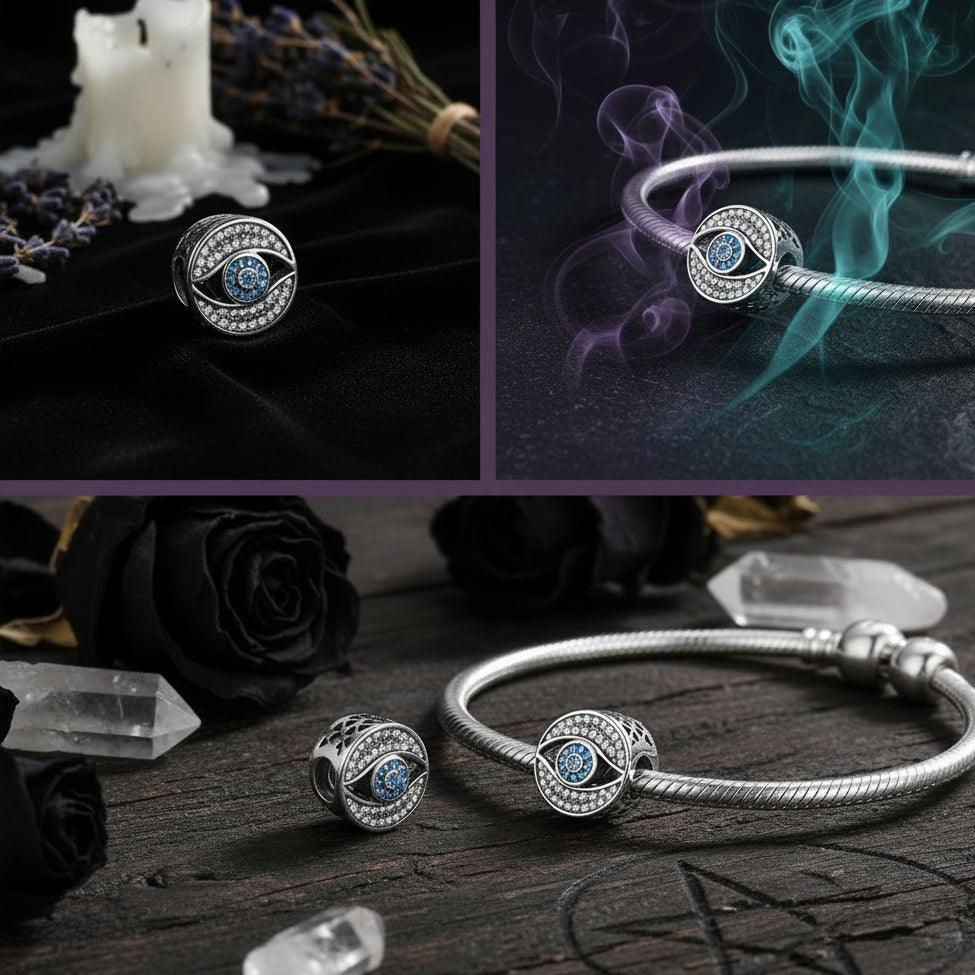 Silver eye-shaped charm with blue gemstones on a light blue background
