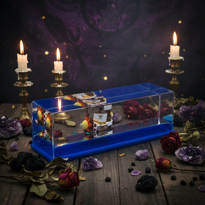 Toy ship in a clear display case with blue top on a white background