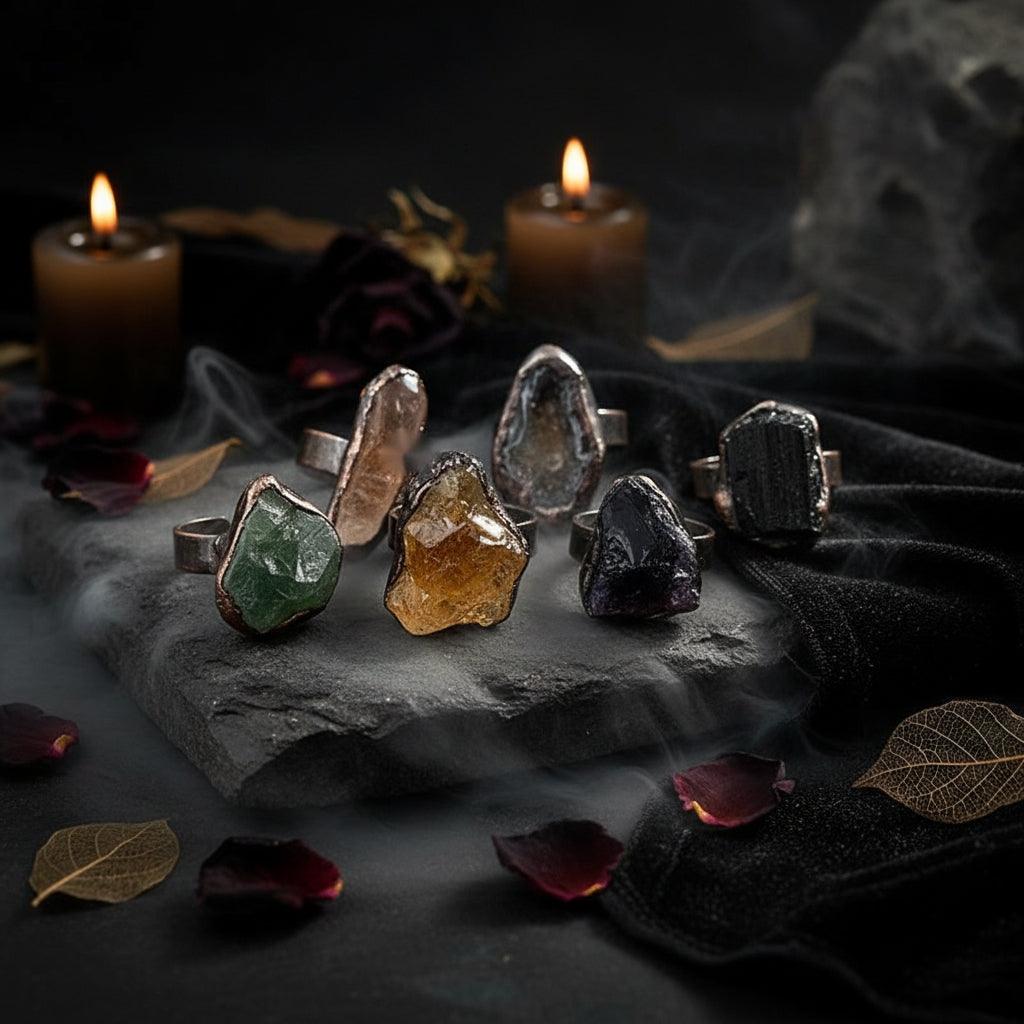 Set of six unique stone rings on a white background