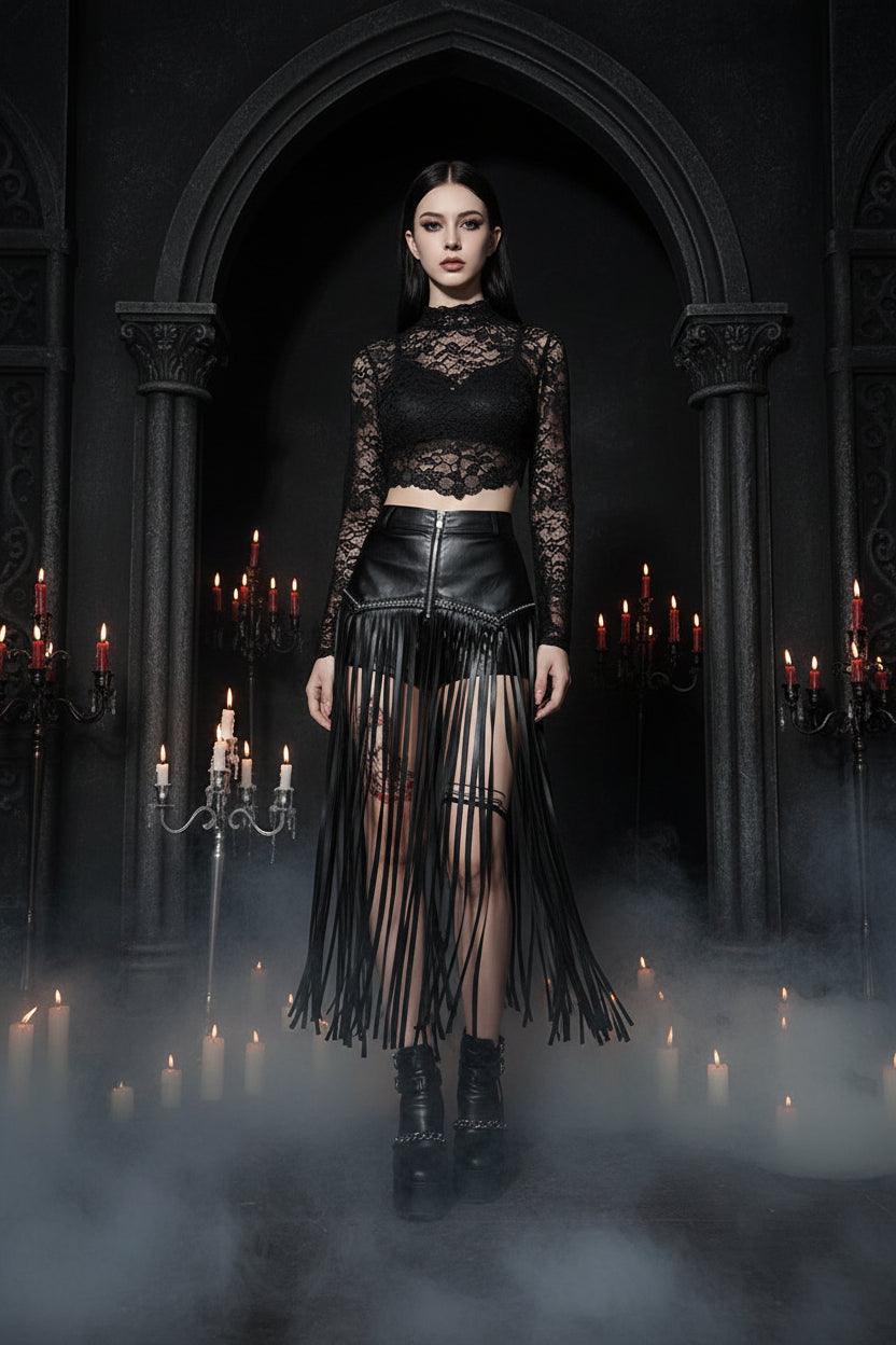 Person wearing a black fringe skirt and boots in a bedroom setting