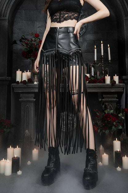 Person wearing a black fringe skirt and high-heeled boots in a room with furniture.
