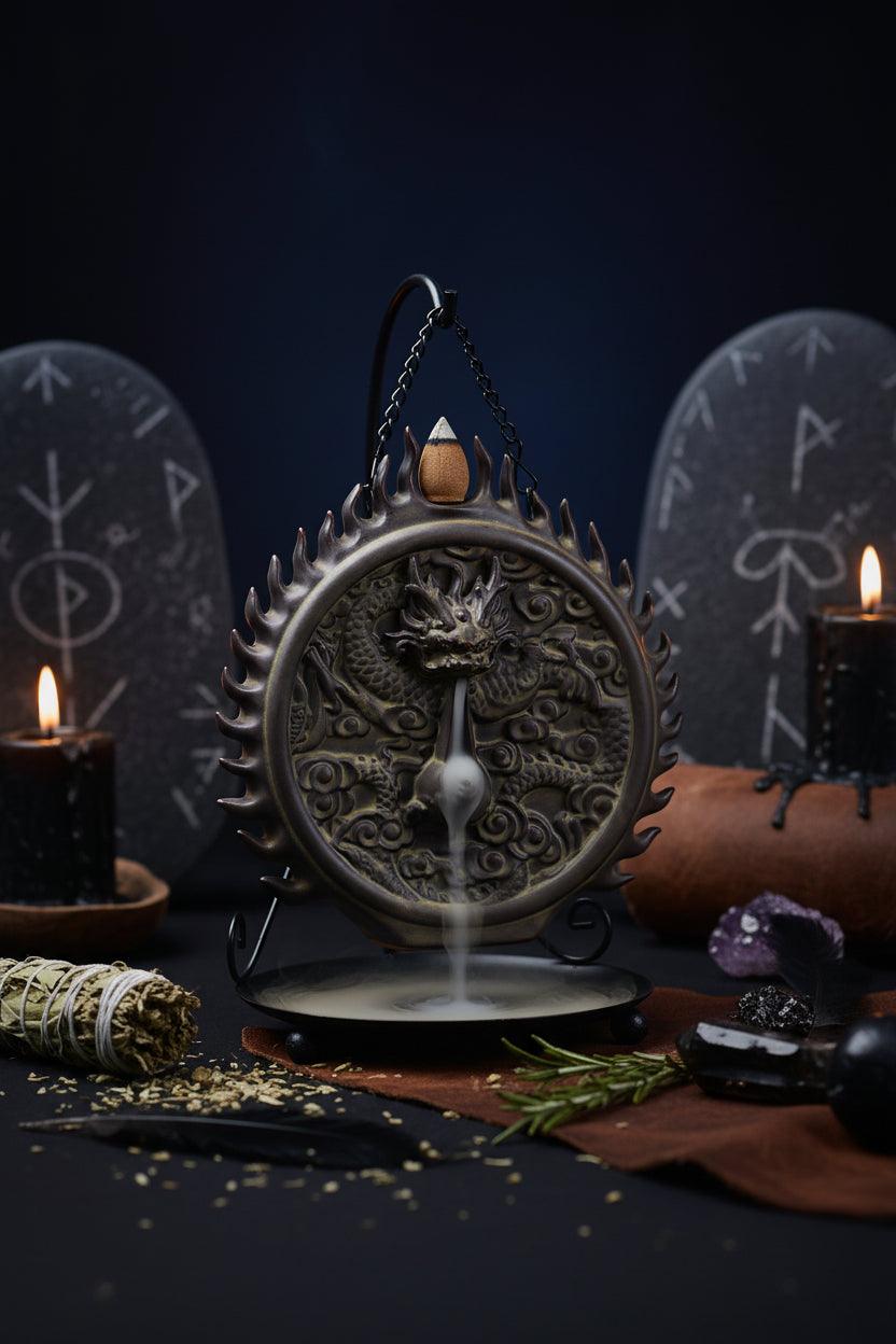 Decorative incense burner with dragon design on a black background