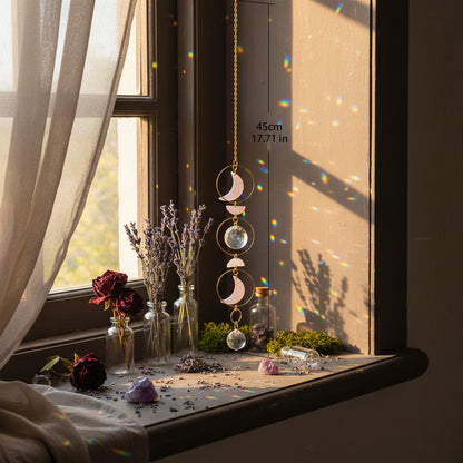 Decorative hanging chain with pink stones on a neutral background