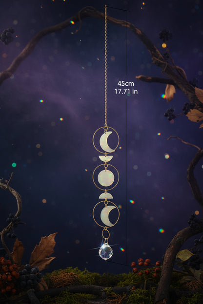 Gold hanging decorative item with circular designs on a light background