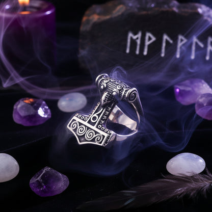 Silver Thor's hammer pendant on a dark background