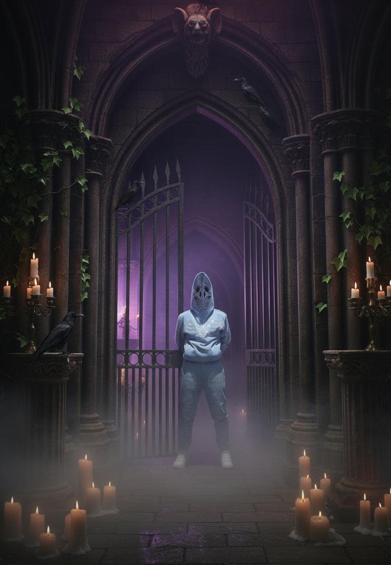 Person wearing a light blue hoodie with a skull design against a blue sky.