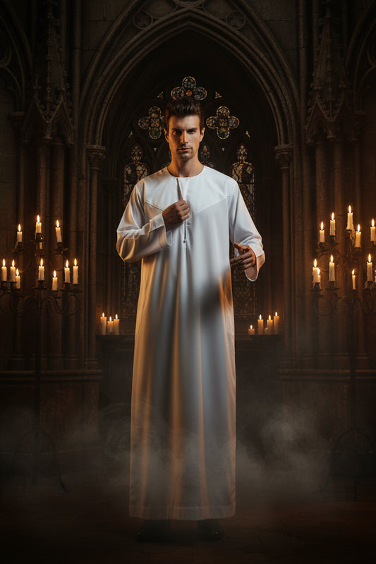 Man wearing a long white robe on a white background