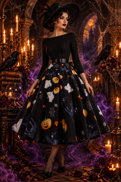 A long-sleeve black dress with a wide flared skirt featuring a Halloween print of pumpkins, ghosts, spiders, and cobwebs, shown on a white background.