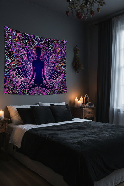 Colorful tapestry with a silhouette of a person meditating in a room with a white couch and decor.
