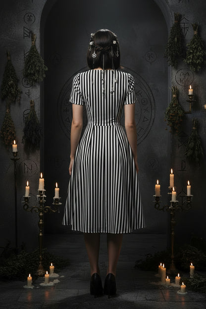 Black and white striped dress on a white background